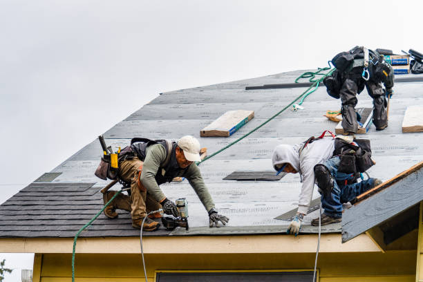 Professional Gutter Installation technician working in Davis, OK